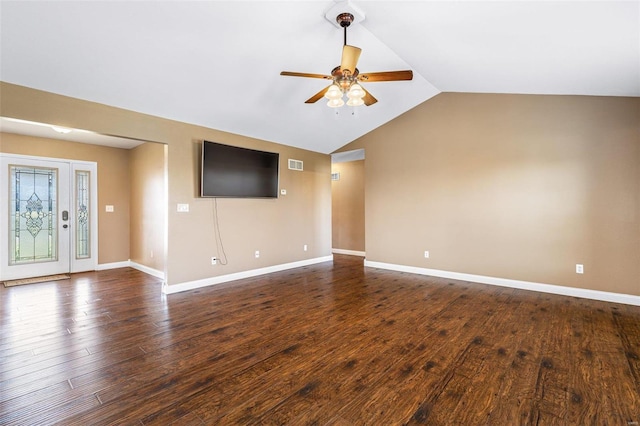 empty room featuring vaulted ceiling, a ceiling fan, dark wood-style flooring, and visible vents