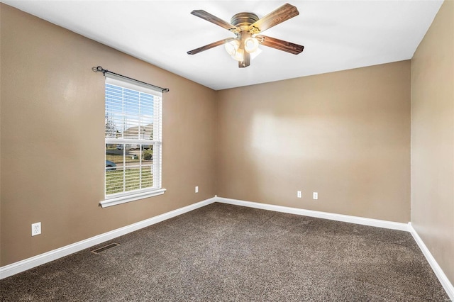 spare room with visible vents, baseboards, carpet, and ceiling fan