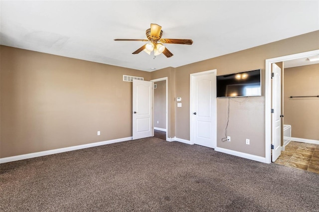 unfurnished bedroom featuring visible vents, ceiling fan, baseboards, and carpet floors