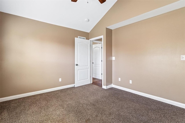 unfurnished room featuring visible vents, high vaulted ceiling, a ceiling fan, dark carpet, and baseboards