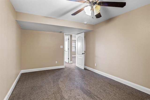 unfurnished room featuring ceiling fan, baseboards, and dark colored carpet