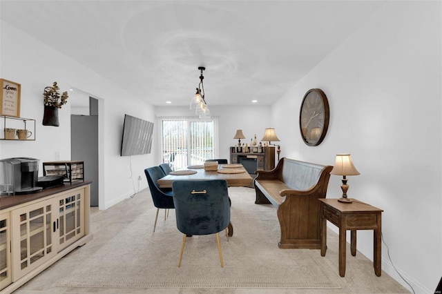 living room featuring recessed lighting, light colored carpet, and baseboards