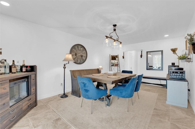 dining area with recessed lighting and baseboards