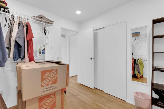 walk in closet featuring visible vents and light wood finished floors