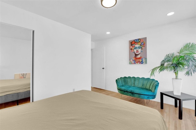 bedroom featuring recessed lighting and wood finished floors