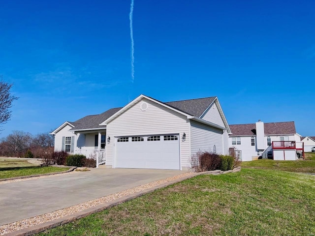 ranch-style house with a front lawn, a garage, and driveway