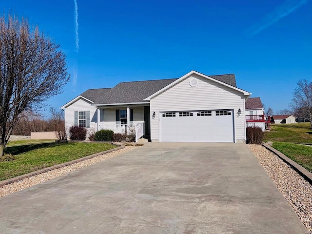 ranch-style home with a porch, a shingled roof, concrete driveway, a front yard, and an attached garage