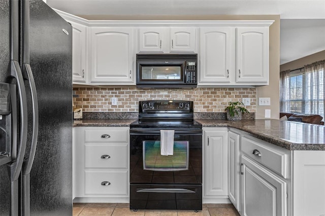 kitchen with black appliances, white cabinets, dark countertops, and tasteful backsplash