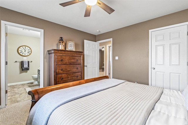 bedroom with baseboards, connected bathroom, a ceiling fan, and carpet