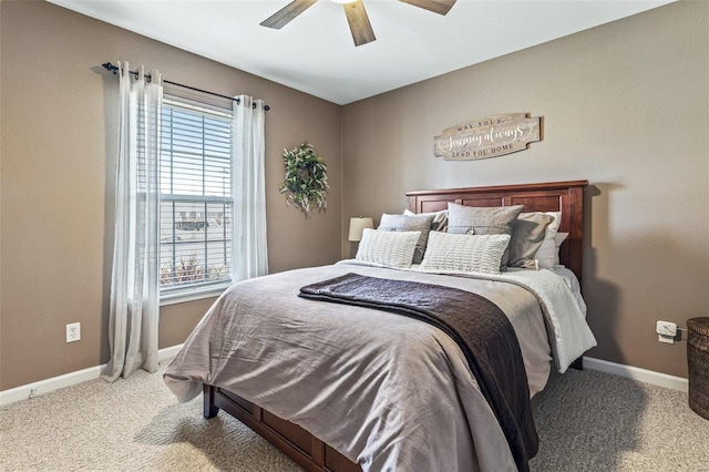 carpeted bedroom featuring ceiling fan and baseboards