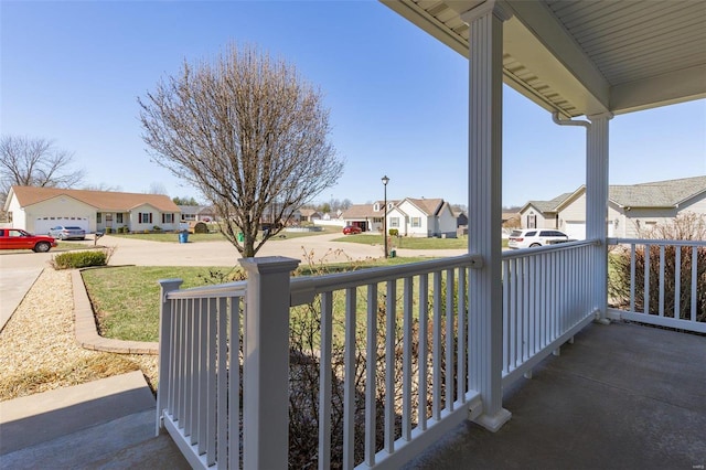 balcony featuring a residential view and a porch