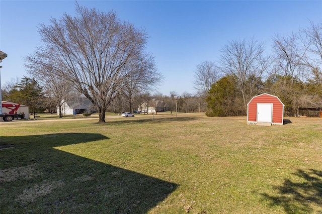 view of yard featuring an outbuilding and a storage unit