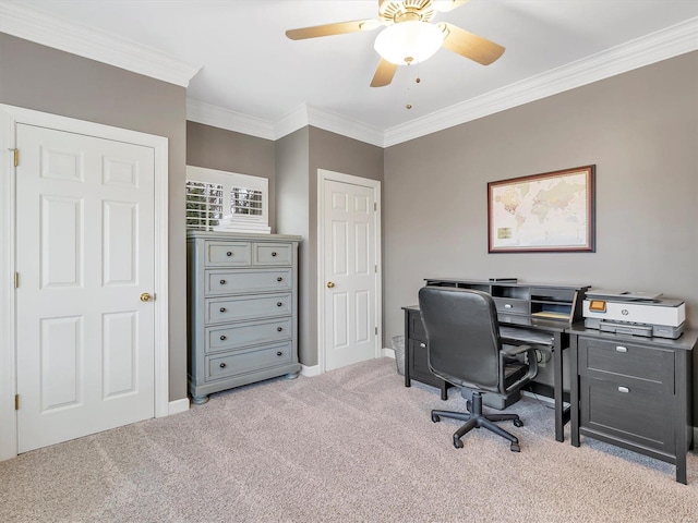 office area featuring ceiling fan, baseboards, ornamental molding, and carpet flooring