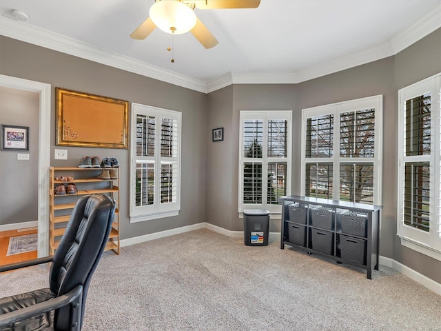 office area with a wealth of natural light, light colored carpet, baseboards, and a ceiling fan