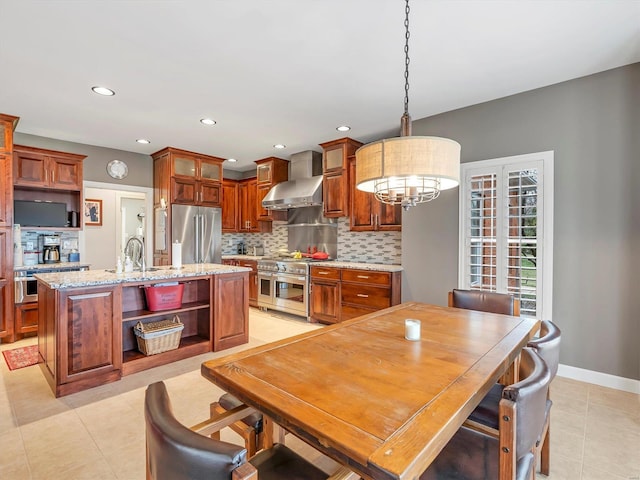 dining area featuring light tile patterned flooring, a notable chandelier, recessed lighting, and baseboards