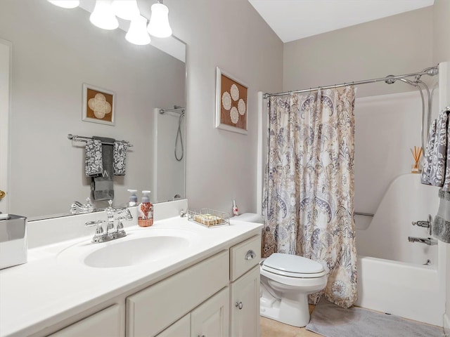 full bath with vanity, toilet, and shower / bath combo