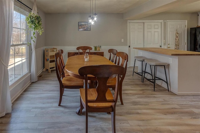 dining area featuring light wood-type flooring