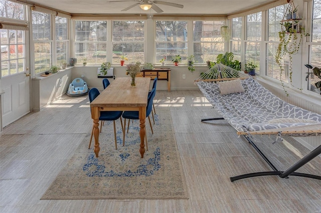 sunroom featuring ceiling fan