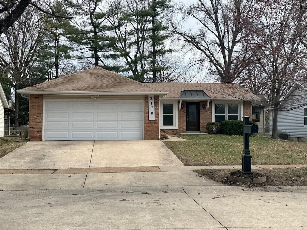 ranch-style house with a garage, brick siding, roof with shingles, and concrete driveway