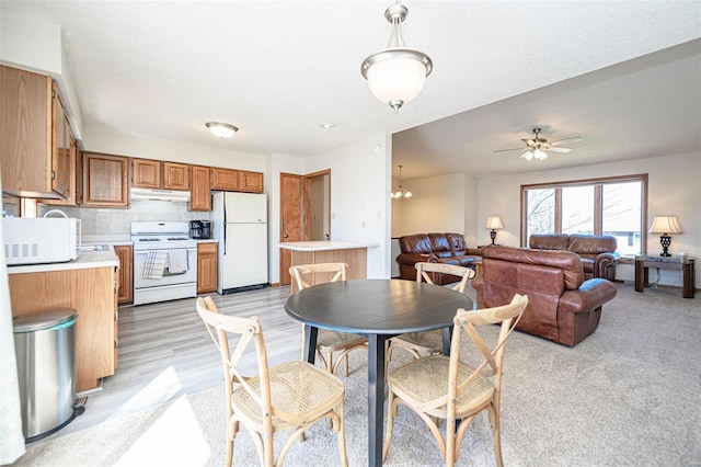 dining space featuring a ceiling fan