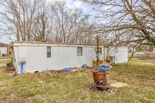 back of house with a yard