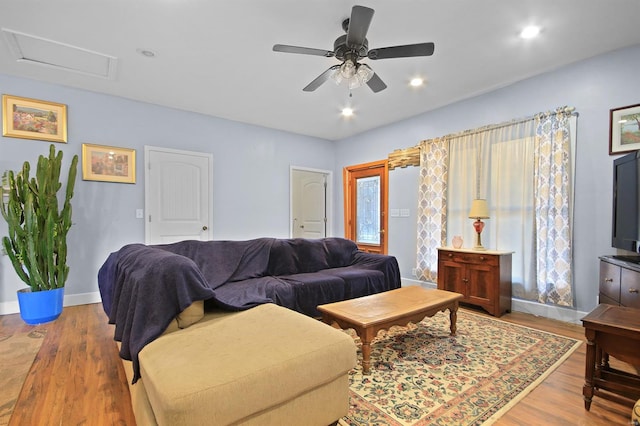 living room with wood finished floors, baseboards, attic access, recessed lighting, and ceiling fan