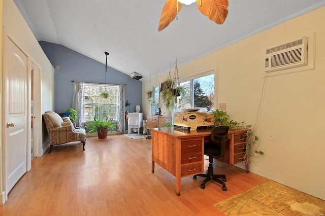 office featuring light wood-style flooring, an AC wall unit, a ceiling fan, and vaulted ceiling