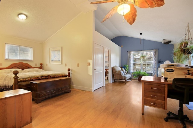 bedroom with a ceiling fan, baseboards, vaulted ceiling, light wood-style floors, and a textured ceiling