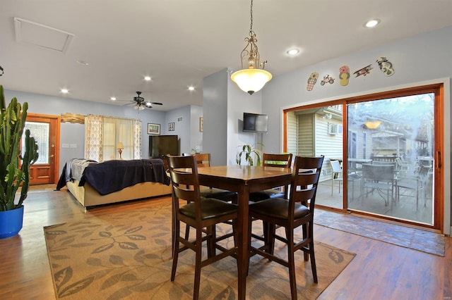 dining room with a ceiling fan, recessed lighting, and wood finished floors