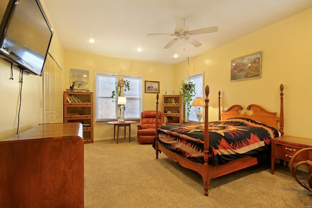 carpeted bedroom with recessed lighting, multiple windows, baseboards, and ceiling fan