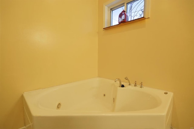 full bathroom featuring a jetted tub