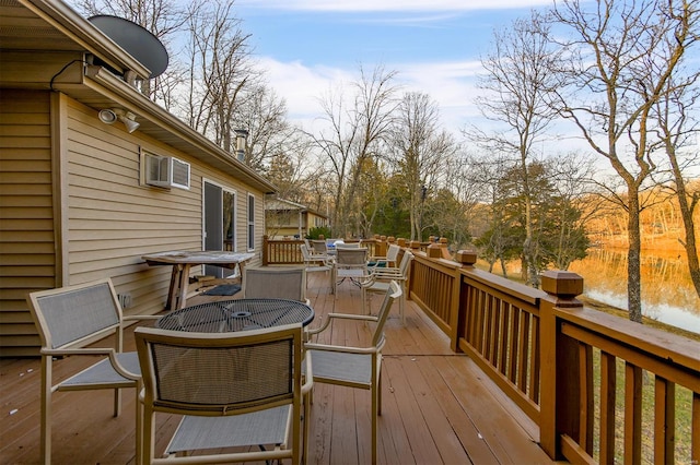 wooden deck with outdoor dining space