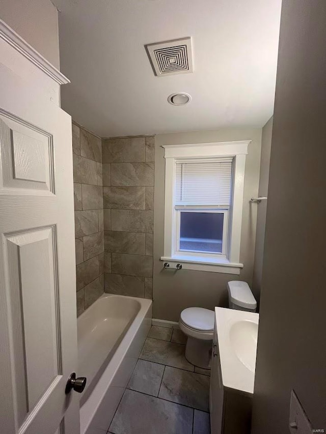 bathroom featuring visible vents, toilet, tile patterned flooring, baseboards, and vanity