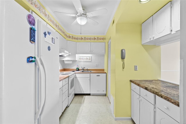 kitchen featuring a sink, white appliances, under cabinet range hood, and white cabinets