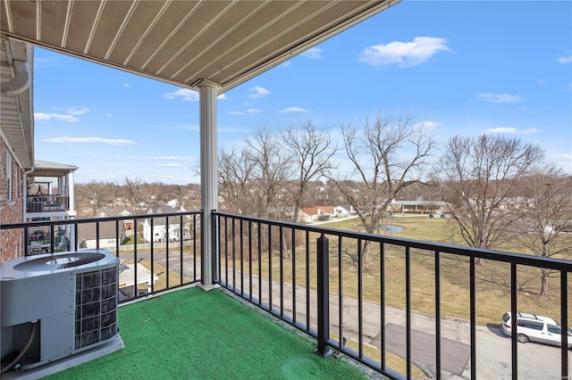 balcony with central AC unit and a residential view