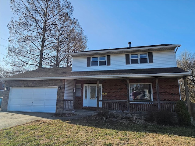 traditional home featuring a garage, brick siding, covered porch, and driveway