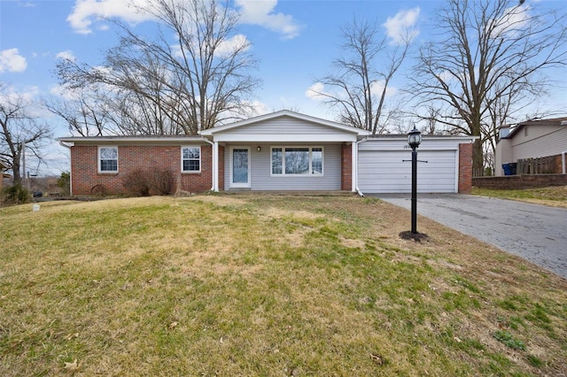 ranch-style home with aphalt driveway, brick siding, a garage, and a front lawn