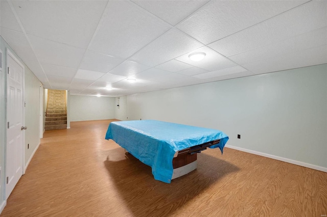 playroom with baseboards, a paneled ceiling, light wood-style floors, and pool table