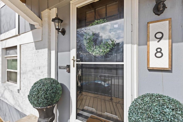 entrance to property with brick siding