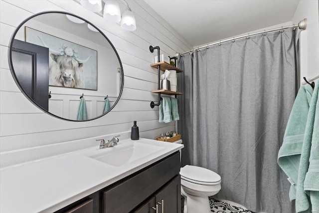 full bath featuring toilet and vanity