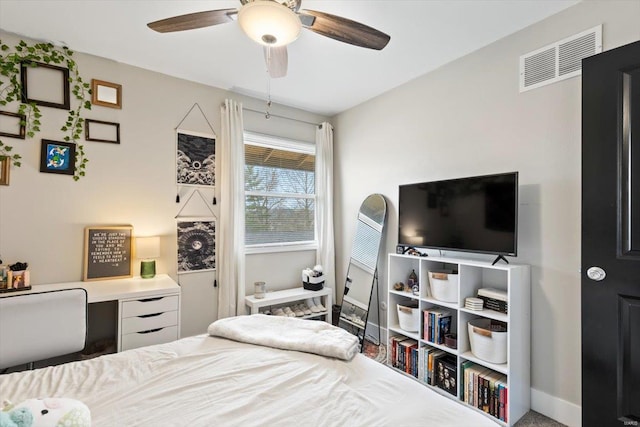 bedroom with visible vents, baseboards, and ceiling fan