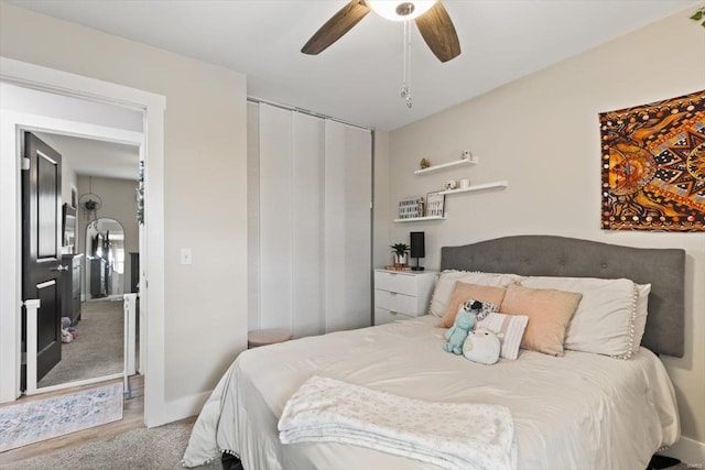 bedroom featuring baseboards, a ceiling fan, and carpet floors