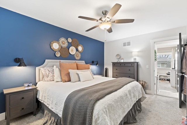 bedroom with a ceiling fan, visible vents, and carpet floors