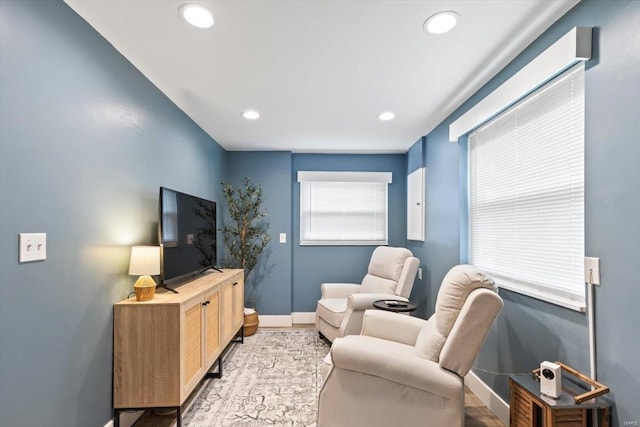 living room featuring recessed lighting and baseboards