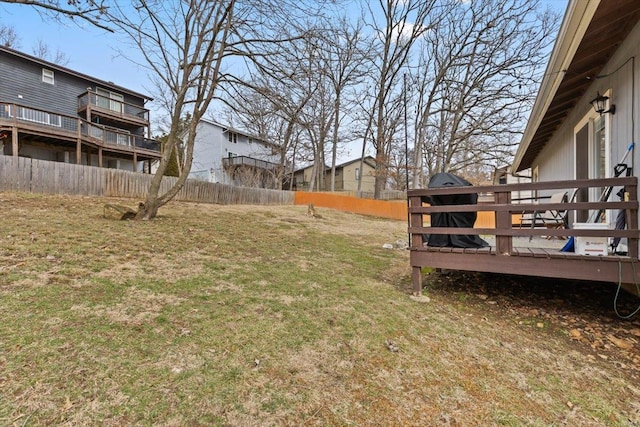 view of yard featuring a deck and fence