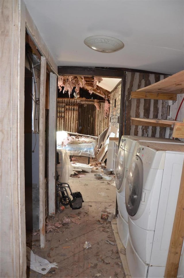 laundry area with washing machine and clothes dryer and laundry area