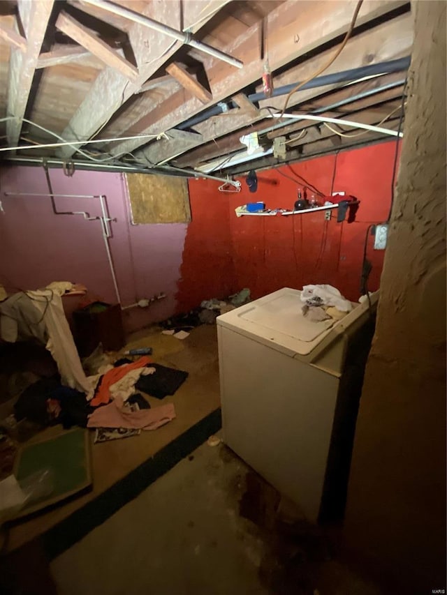 unfinished basement featuring washer / clothes dryer