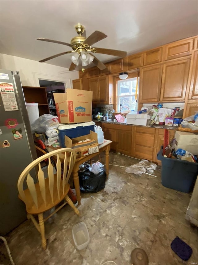 kitchen with freestanding refrigerator and ceiling fan