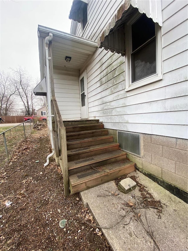 property entrance featuring fence