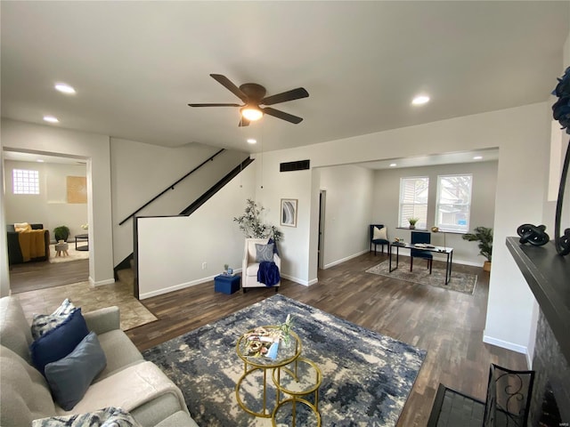 living area featuring visible vents, wood finished floors, recessed lighting, stairway, and ceiling fan